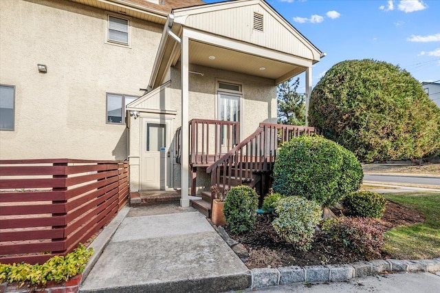 property entrance featuring stucco siding
