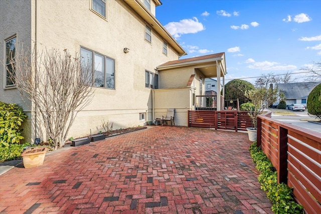 view of side of property with stucco siding