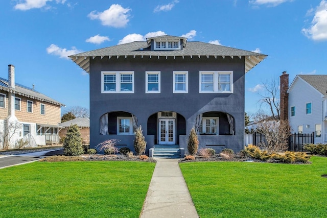 view of front of property featuring roof with shingles, a front yard, fence, and french doors