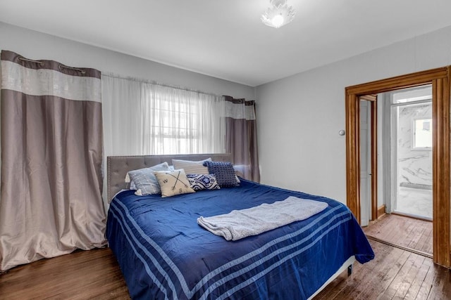 bedroom with wood-type flooring