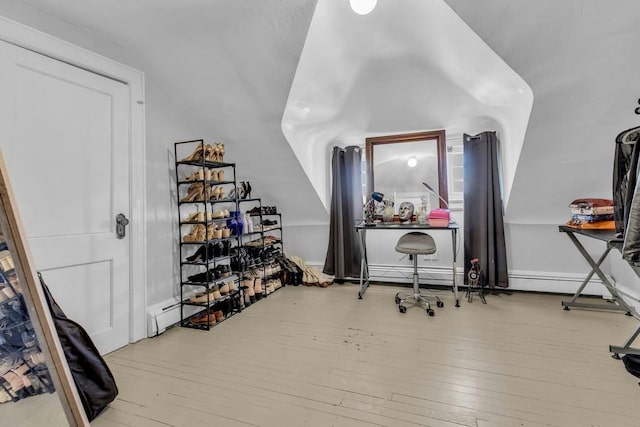 interior space featuring baseboards and hardwood / wood-style flooring