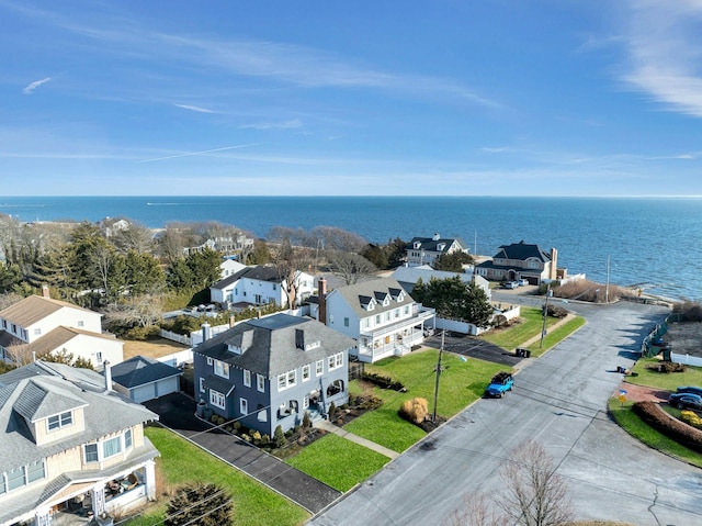 bird's eye view with a water view and a residential view