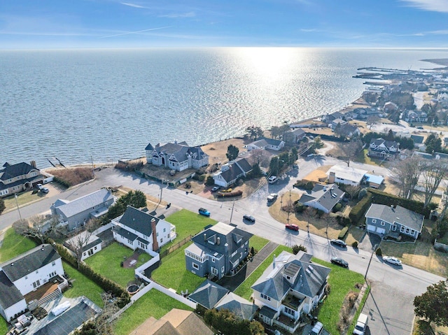 bird's eye view featuring a water view and a residential view