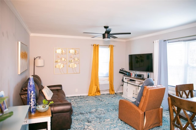 living room featuring ornamental molding, a ceiling fan, and baseboards