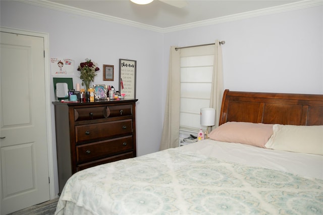 bedroom with ceiling fan and crown molding