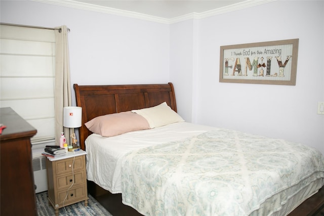 bedroom featuring radiator heating unit and crown molding