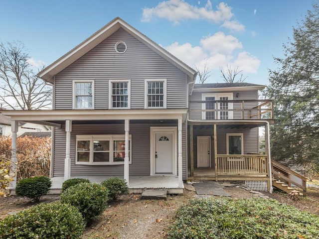 view of front of house with a balcony and covered porch