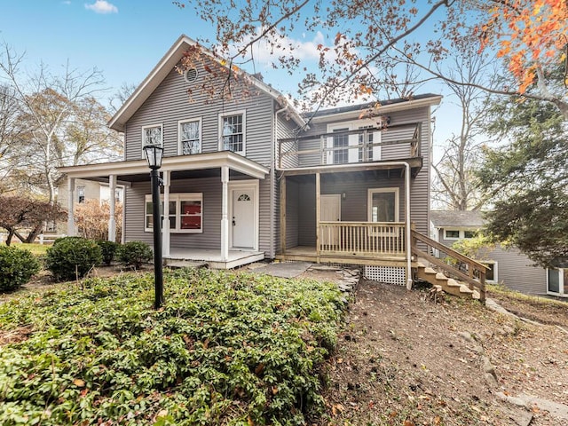 view of front of house with a porch and a balcony