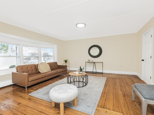 living area featuring light wood-style flooring and baseboards