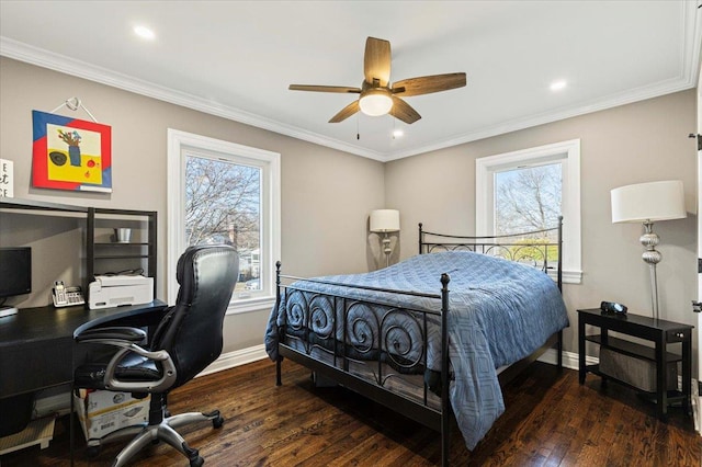 bedroom featuring baseboards, multiple windows, and wood finished floors