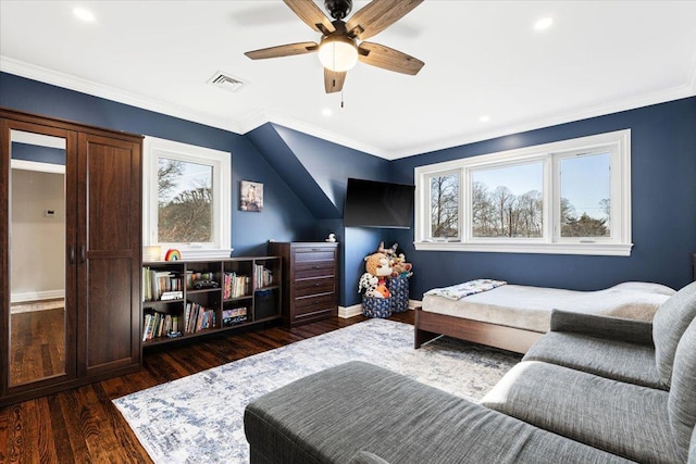 living area featuring dark wood finished floors, crown molding, visible vents, and a wealth of natural light