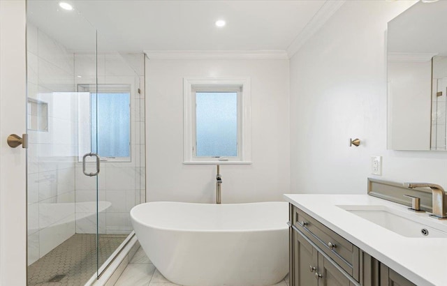 full bath featuring vanity, recessed lighting, a freestanding bath, a shower stall, and crown molding