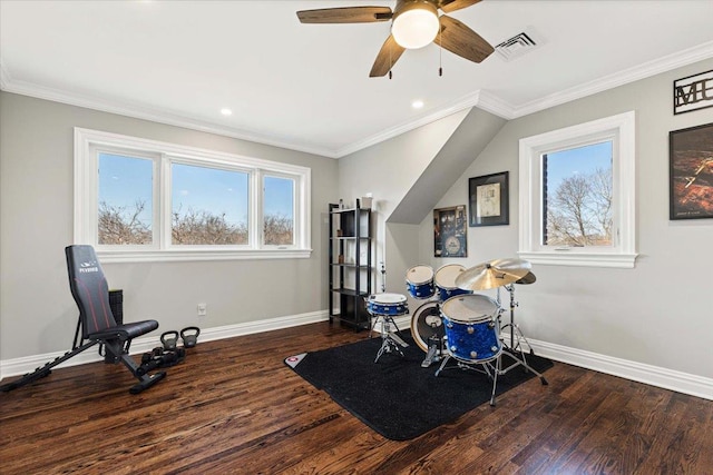 game room featuring visible vents, baseboards, wood finished floors, and ornamental molding