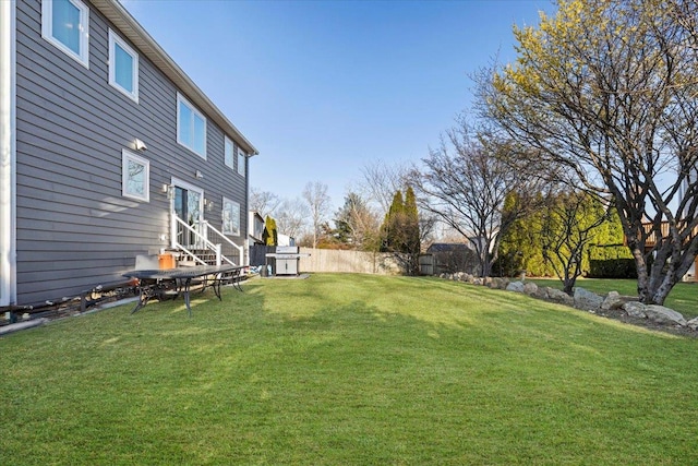 view of yard featuring fence