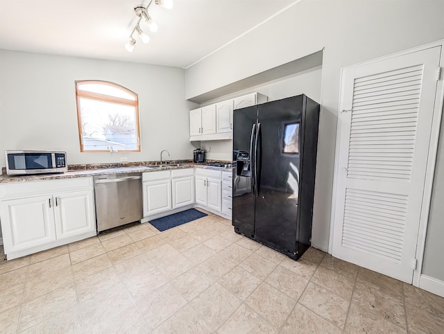 kitchen with white cabinets, stainless steel appliances, and a sink