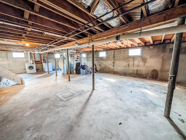 basement with washer / clothes dryer and electric panel