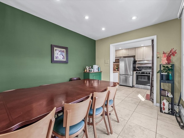 dining space with recessed lighting and light tile patterned floors