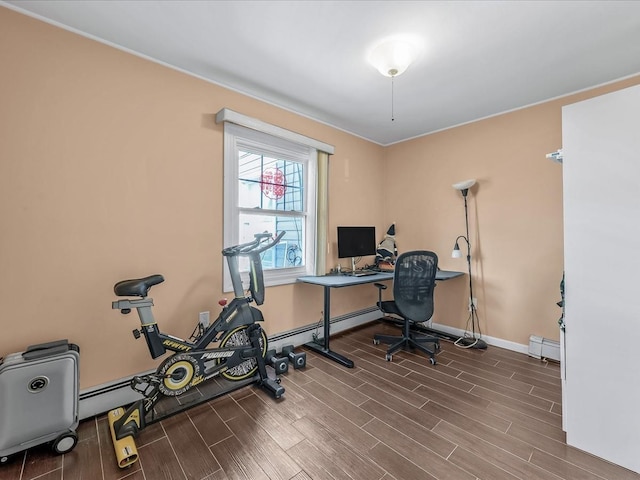 office area featuring baseboards, wood finished floors, and a baseboard radiator
