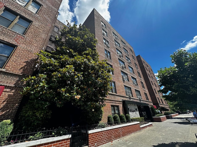 view of building exterior featuring fence