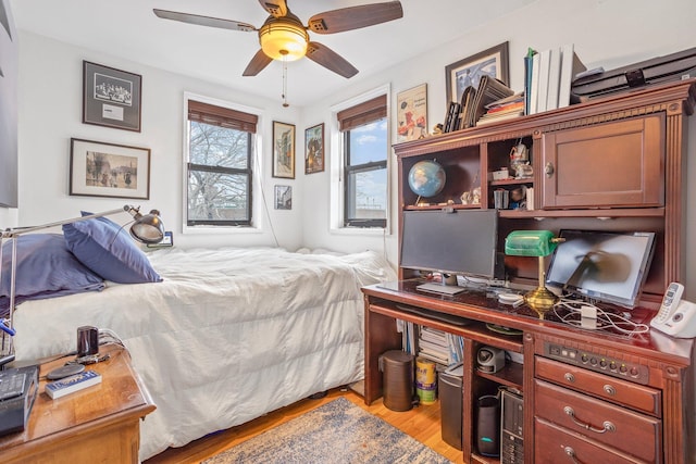 bedroom with ceiling fan and light wood finished floors