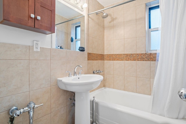 full bath with shower / bath combination with curtain and tile walls