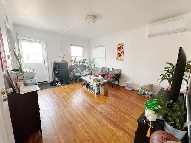 office featuring hardwood / wood-style flooring, baseboards, and a wall mounted air conditioner