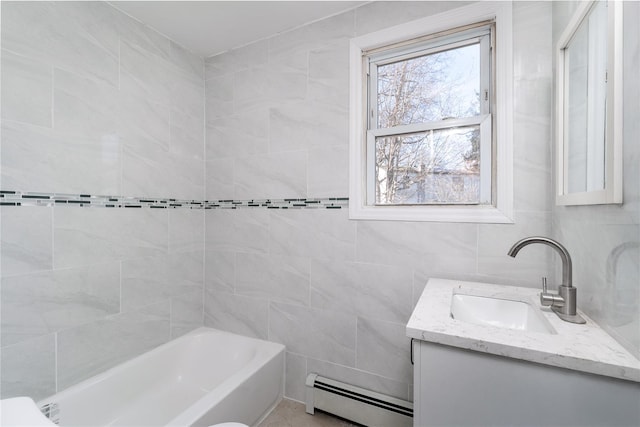 bathroom with shower / bath combination, baseboard heating, tile walls, and vanity