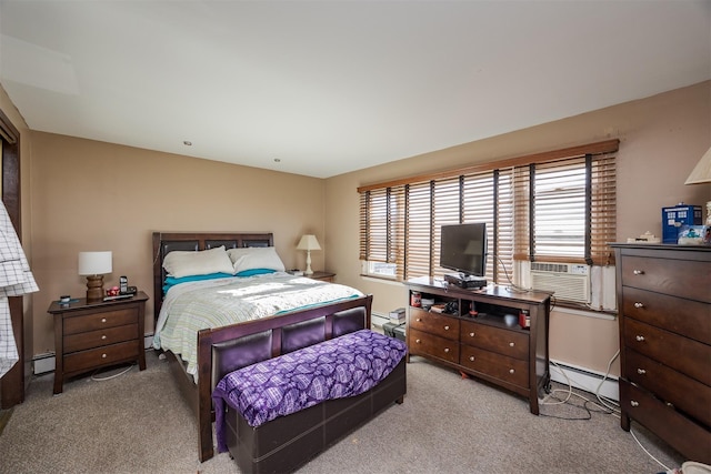 bedroom with light carpet and a baseboard radiator