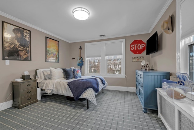 bedroom featuring ornamental molding, visible vents, light carpet, and baseboards