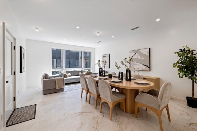 dining space featuring recessed lighting, marble finish floor, and visible vents