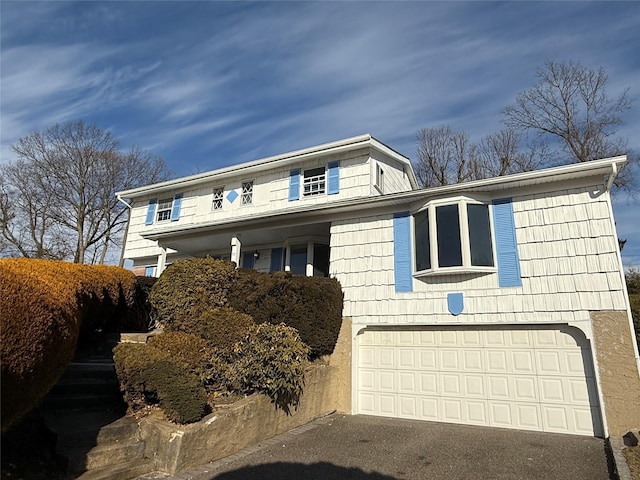 view of front of home with a garage and driveway