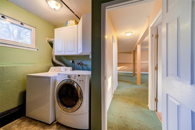 laundry area with washing machine and dryer, cabinet space, and carpet floors