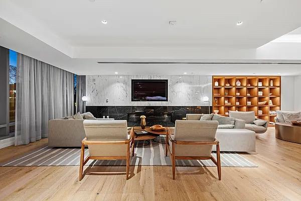 living room featuring light wood-type flooring and recessed lighting