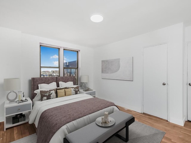 bedroom featuring light wood-style floors