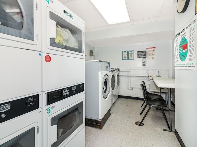 shared laundry area featuring washer and dryer and stacked washer / dryer