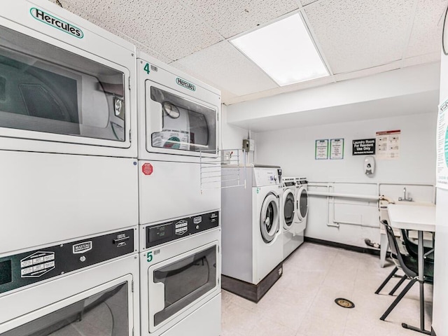 shared laundry area featuring washer and dryer and stacked washer / dryer