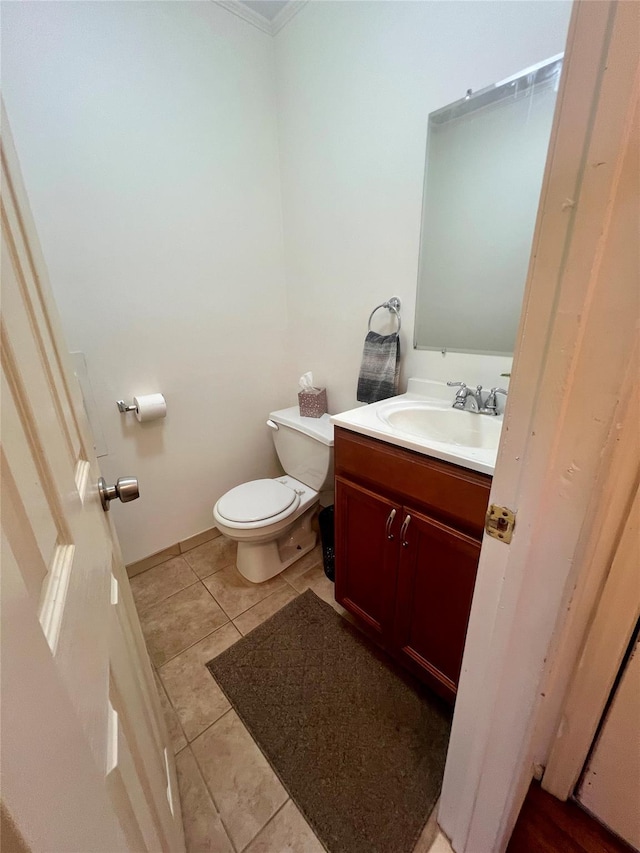 bathroom with vanity, tile patterned flooring, and toilet