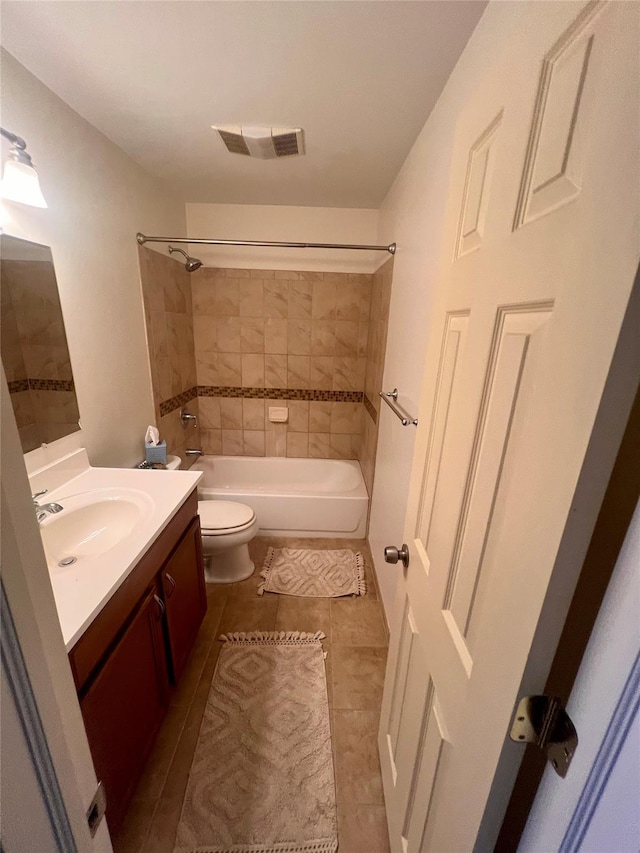 full bath with visible vents, toilet, tile patterned floors, vanity, and shower / bathing tub combination