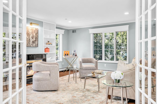 living room with visible vents, ornamental molding, recessed lighting, french doors, and wood finished floors