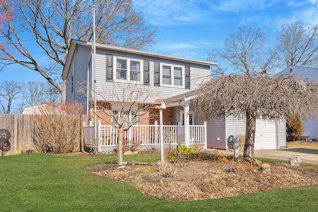 view of front facade with covered porch, concrete driveway, an attached garage, fence, and a front lawn