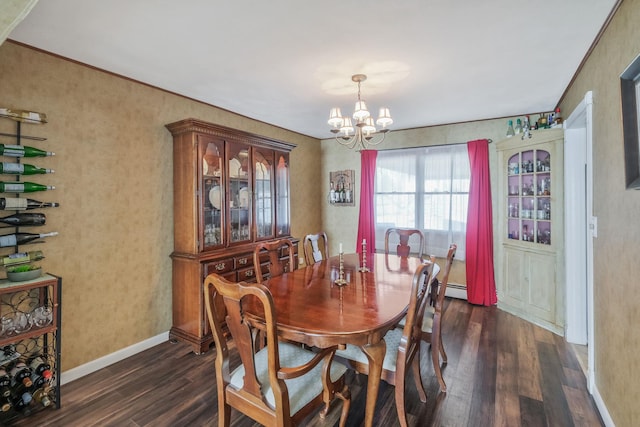 dining space with a chandelier, dark wood finished floors, and baseboards