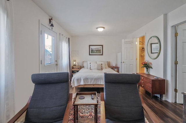 bedroom featuring dark wood-style flooring