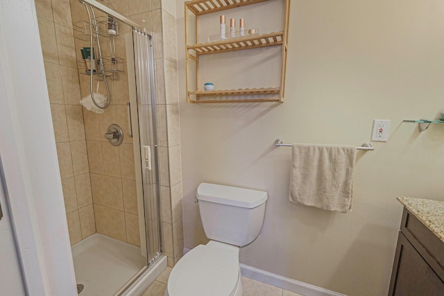 bathroom featuring a stall shower, vanity, and toilet