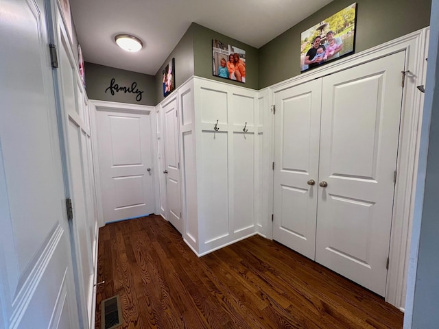 mudroom with visible vents and dark wood-style flooring