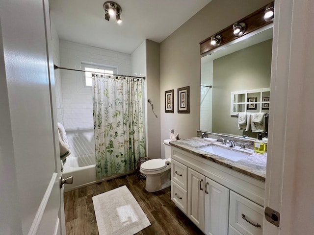 full bathroom with toilet, shower / bath combination with curtain, wood finished floors, and vanity