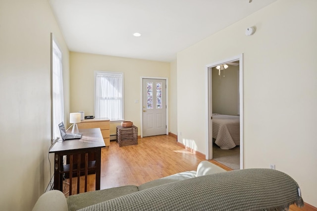 bedroom with baseboards and wood finished floors