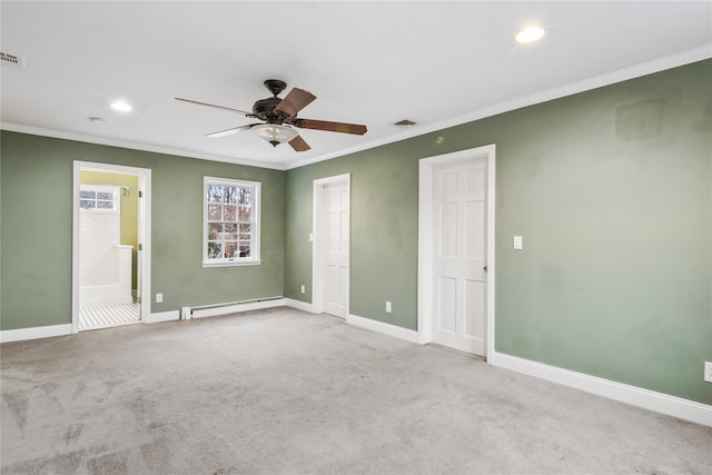 spare room with visible vents, baseboards, a baseboard radiator, ornamental molding, and carpet