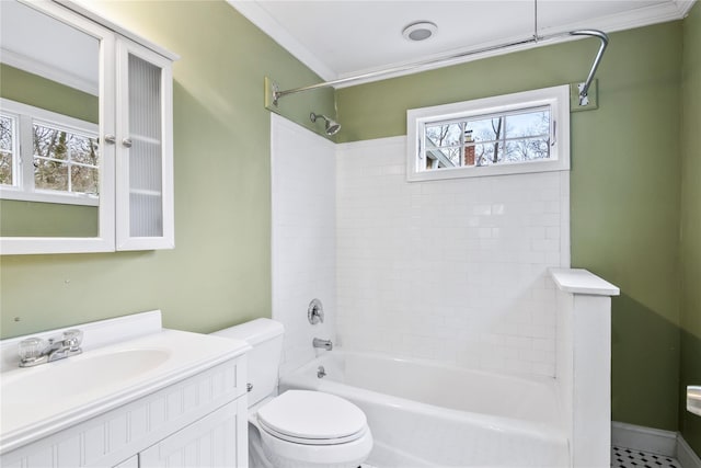 full bathroom featuring ornamental molding, bathtub / shower combination, vanity, and toilet