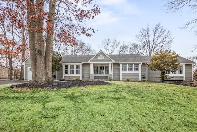 ranch-style home featuring a front yard