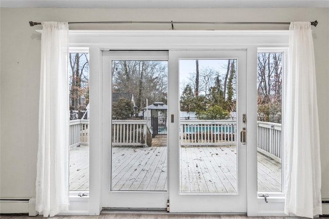 entryway with a baseboard heating unit